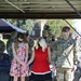 Taylor Family pauses in prayer during Relinquishment of Command Ceremony