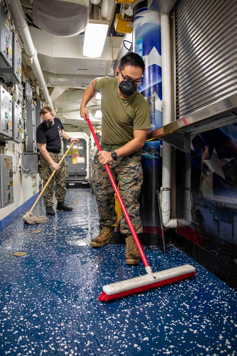 Sailors and Marines Work Together aboard USS Iwo Jima