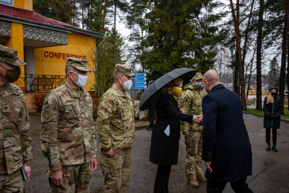 Chargé d’Affaires,  Kristina Kvien shaks hands with Ukraine PM Denys Shmyhal