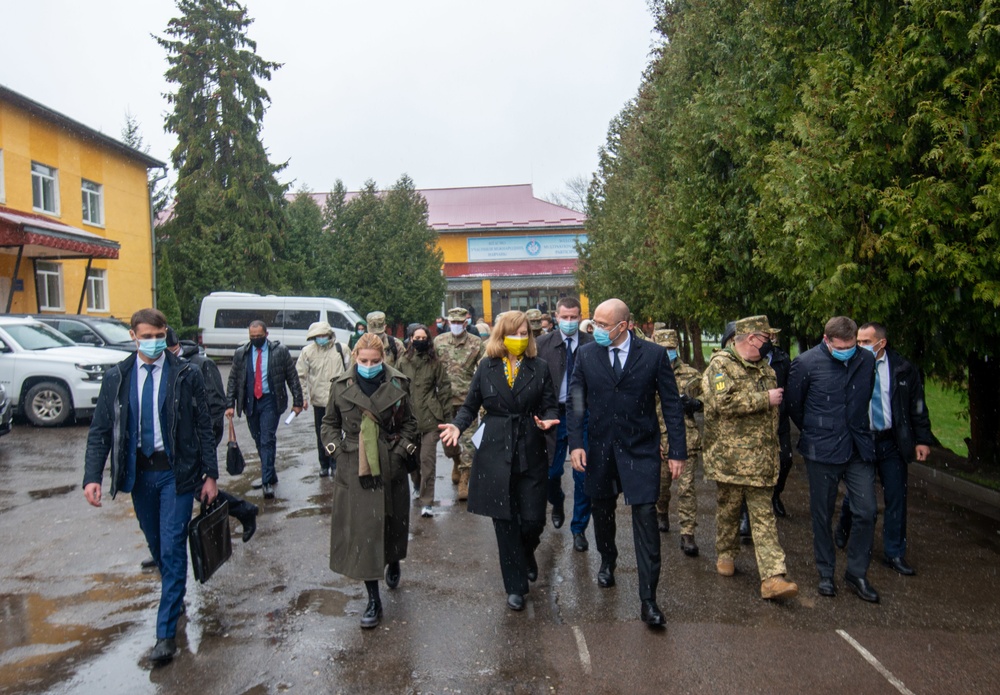 Ukraine Prime Minister Denys Shmyhal and Chargé d’Affaires,  Kristina Kvien  walk to host the JMTG-U TOA