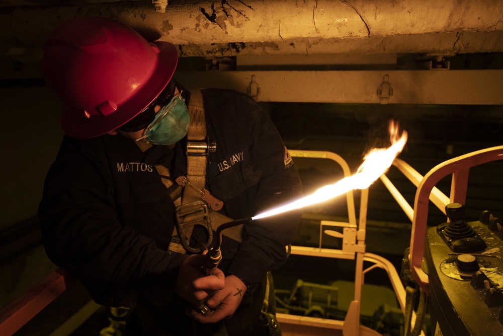 Kearsarge Sailor Repairs Pipe