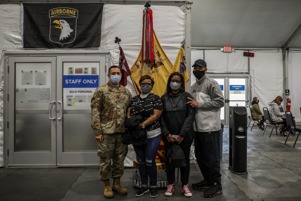 101st Soldier vaccinates the 200,000th community member at the United Center COVID-19 Community Vaccination Center, Chicago