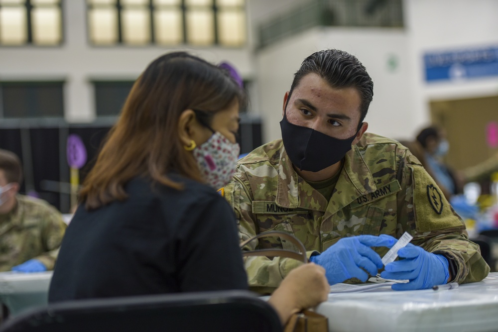 U.S. Army 25th Infantry Division Soldiers Administer Vaccines at Guam Department of Public Health and Social Services COVID-19 Vaccine Clinic