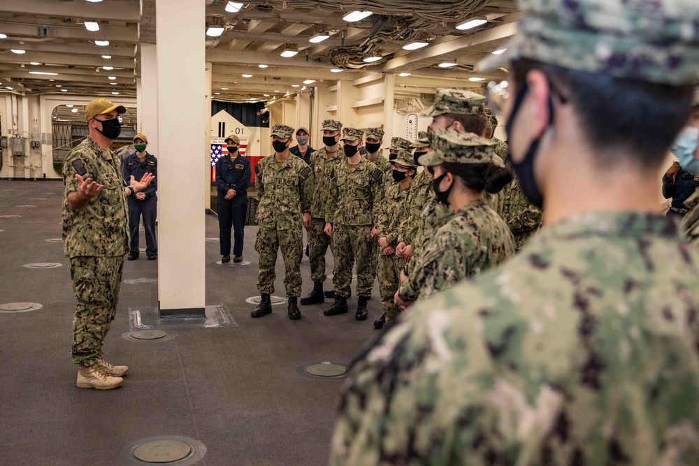 Rear Adm. McLane speaks with midshipmen aboard USS Arlington (LPD 24)