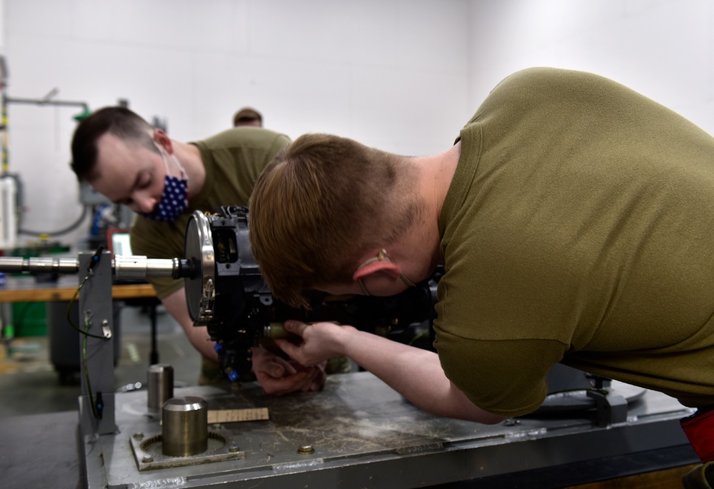 354th MXS Armament conduct maintenance on F-16 Fighting Falcon gun