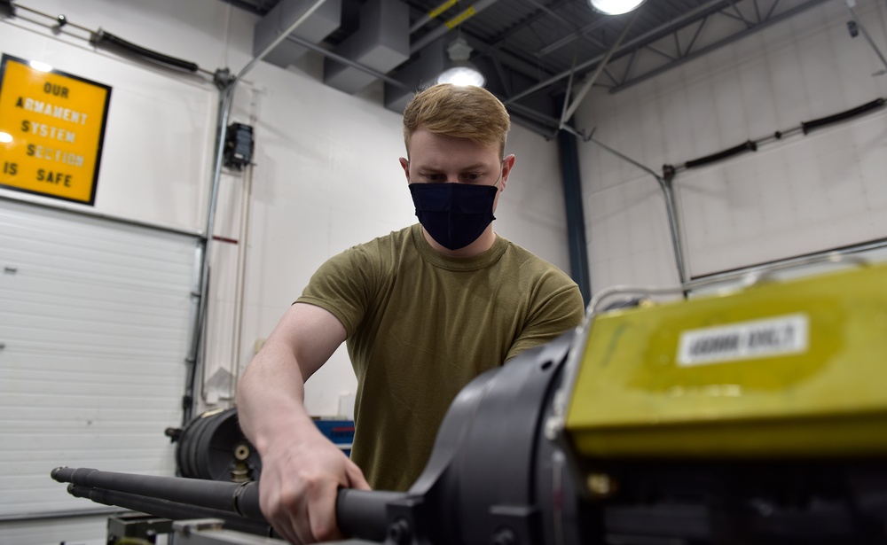354th MXS Armament conduct maintenance on F-16 Fighting Falcon gun