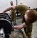 354th MXS Armament conduct maintenance on F-16 Fighting Falcon gun