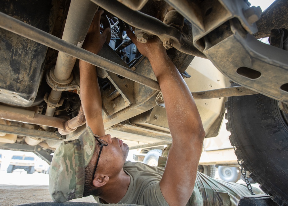 101st Division Sustainment Brigade Troops Perform Motor Pool Maintenance Checks