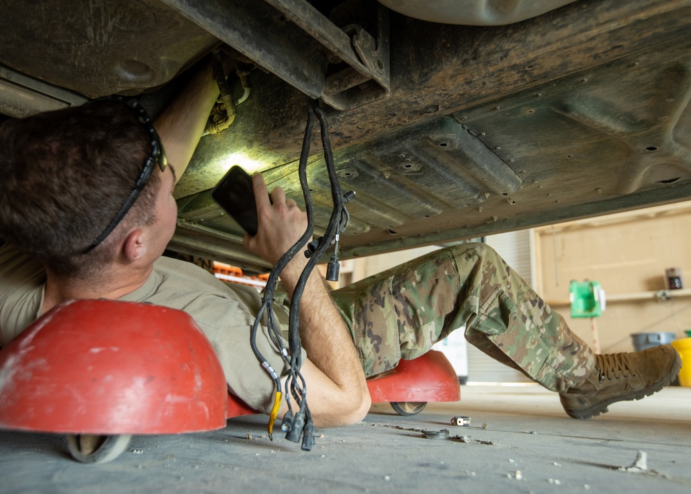 101st Division Sustainment Brigade Troops Perform Motor Pool Maintenance Checks