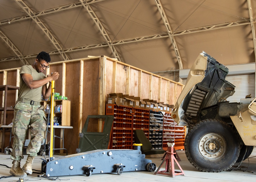 101st Division Sustainment Brigade Troops Perform Motor Pool Maintenance Checks