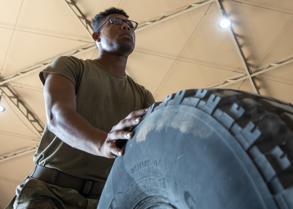 101st Division Sustainment Brigade Troops Perform Motor Pool Maintenance Checks