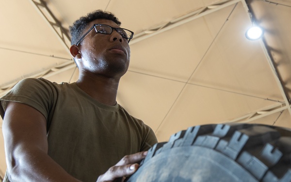 101st Division Sustainment Brigade Troops Perform Motor Pool Maintenance Checks