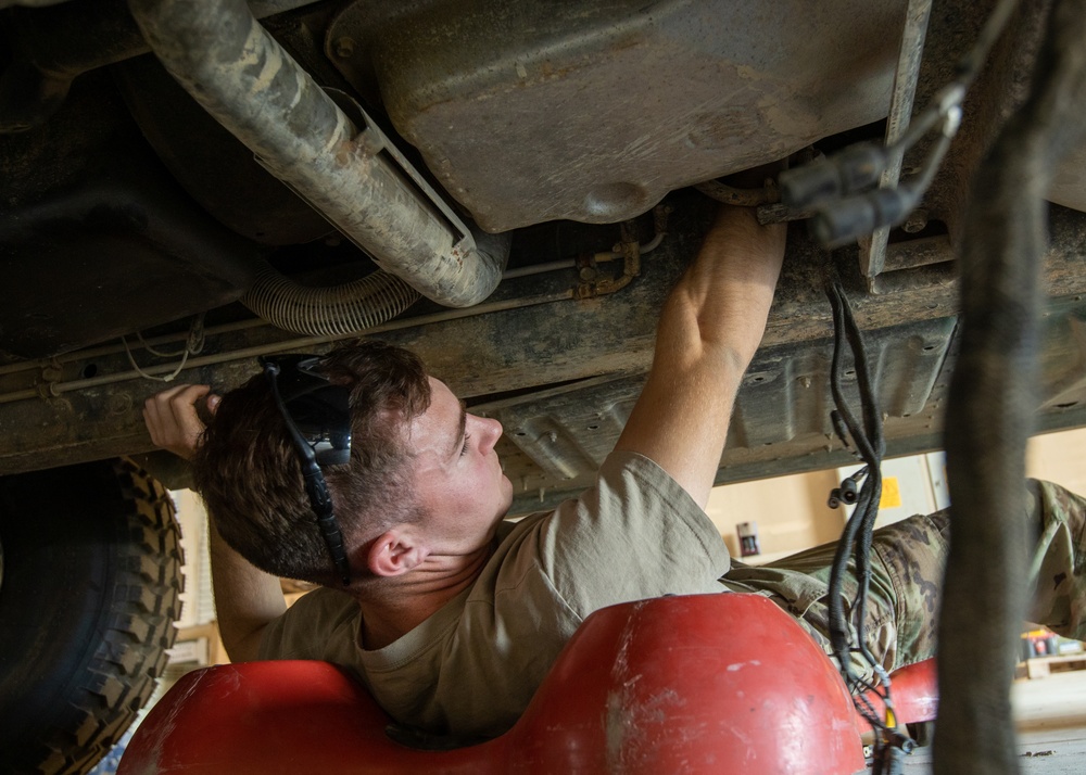 101st Division Sustainment Brigade Troops Perform Motor Pool Maintenance Checks