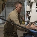 Missile handling technicians complete roll transfer during QA inspection