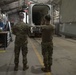 Missile handling technicians complete roll transfer during QA inspection