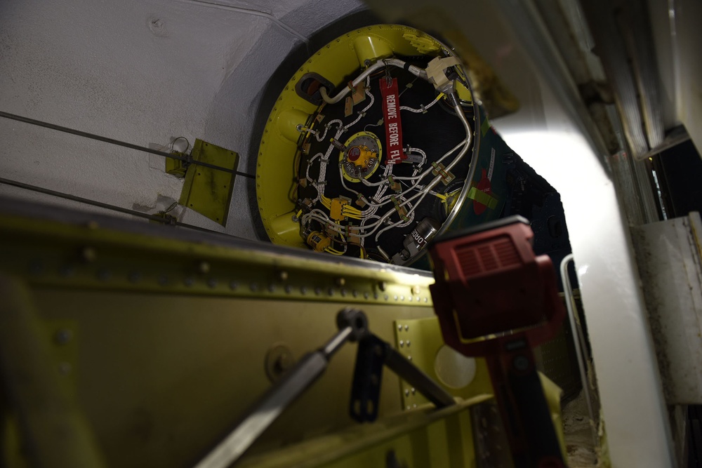 Missile handling technicians complete roll transfer during QA inspection