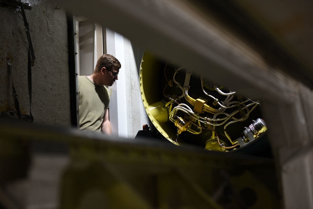 Missile handling technicians complete roll transfer during QA inspection