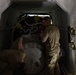 Missile handling technicians complete roll transfer during QA inspection