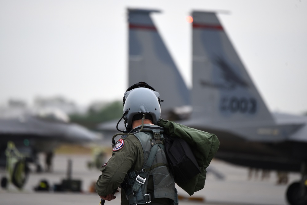 A F-15 Eagle Fighter Pilot Steps to His Jet