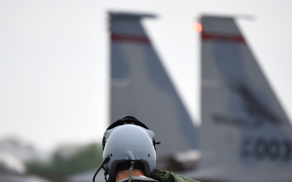 A F-15 Eagle Fighter Pilot Steps to His Jet