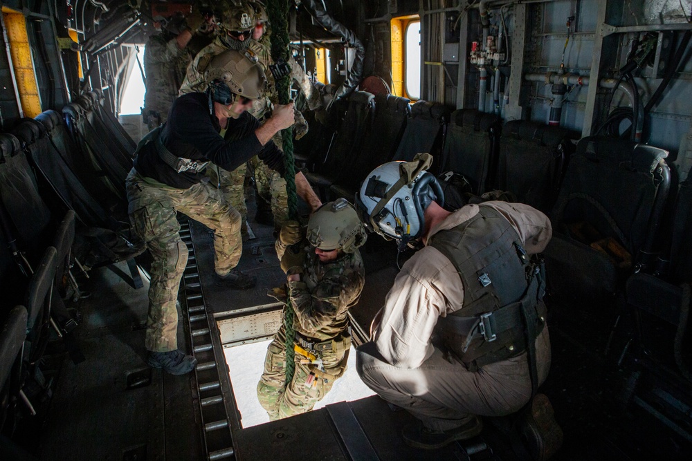 Green Berets fast rope out of Marine aircraft