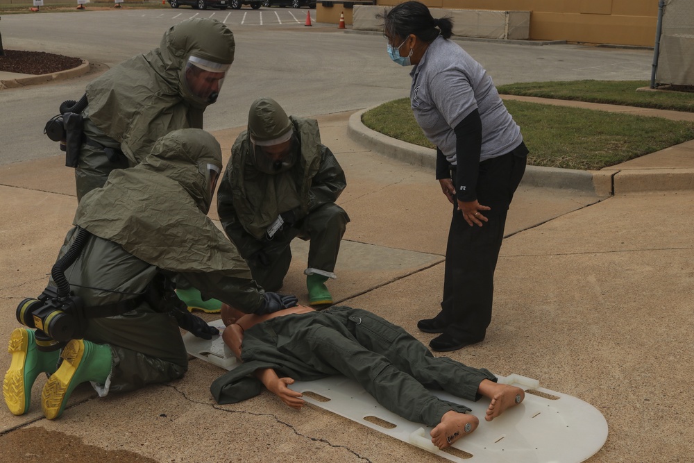 Airmen team up, complete decontamination training