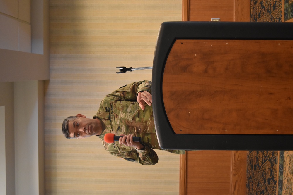 Col. Will McKannay, Fort Riley Garrison Commander, greets participants in the Army Community Partnership Workshop April 15.