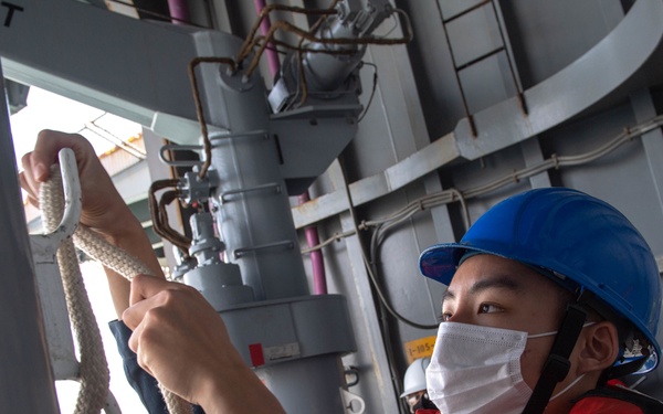 USS America Sailor Secures Line During Small Boat Operations