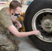 Photo of 461st Crew Chiefs changing aircraft wheel and tire