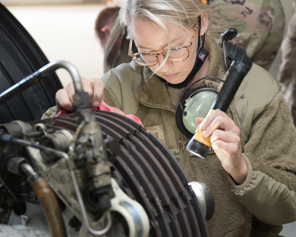 Photo of 461st Crew Chiefs changing aircraft wheel and tire