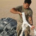 1st TSC Soldiers successfully precision-airdrops GPS-guided pallets in Kuwait test
