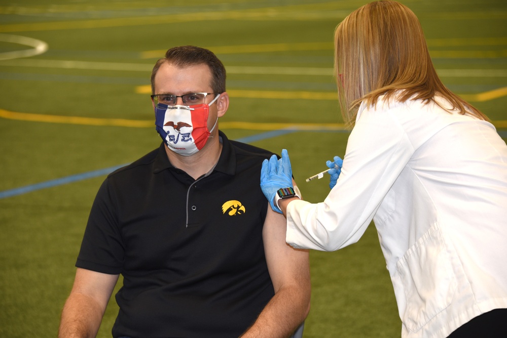 Iowa Lt. Gov. Adam Gregg receives a COVID-19 vaccination