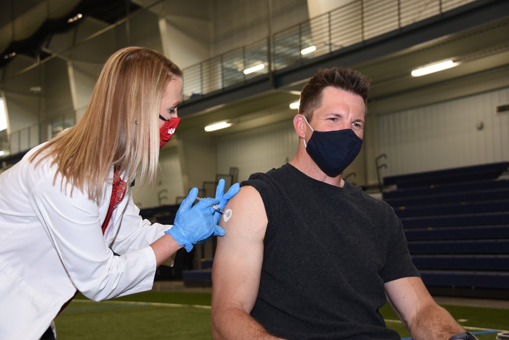 Iowa Hawkeye and NFL football star Dallas Clark receives COVID-19 vaccination in Sioux City