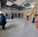 Visitors view construction of new, modern barracks building continues at Fort McCoy