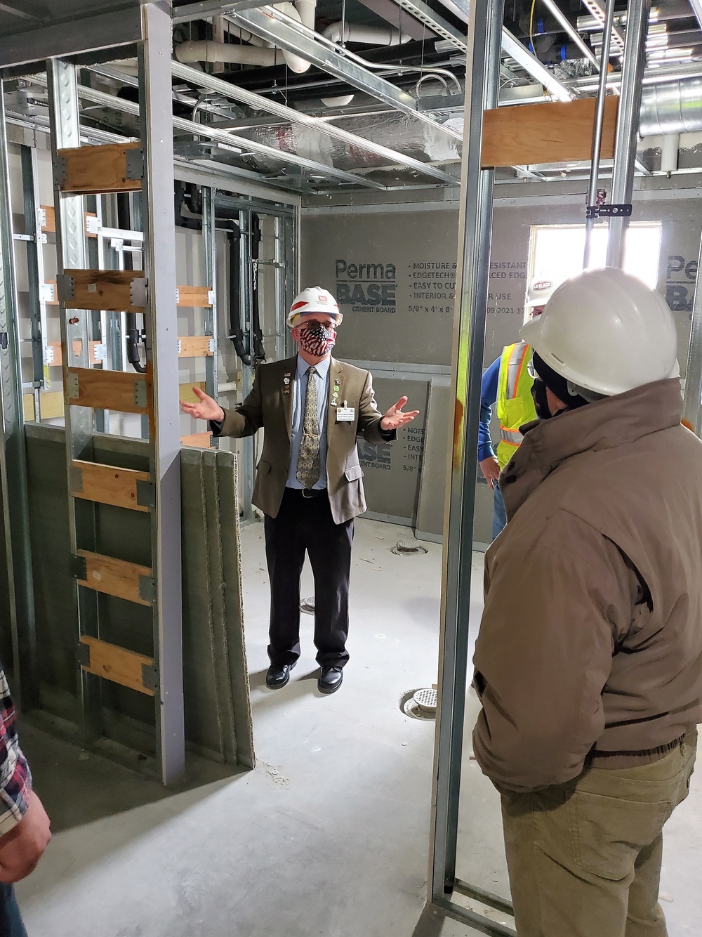 Visitors view construction of new, modern barracks building continues at Fort McCoy