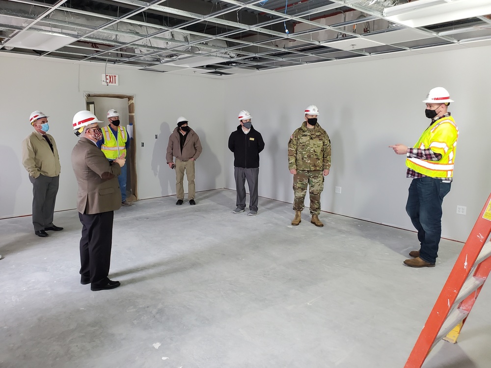 Visitors view construction of new, modern barracks building continues at Fort McCoy