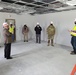 Visitors view construction of new, modern barracks building continues at Fort McCoy