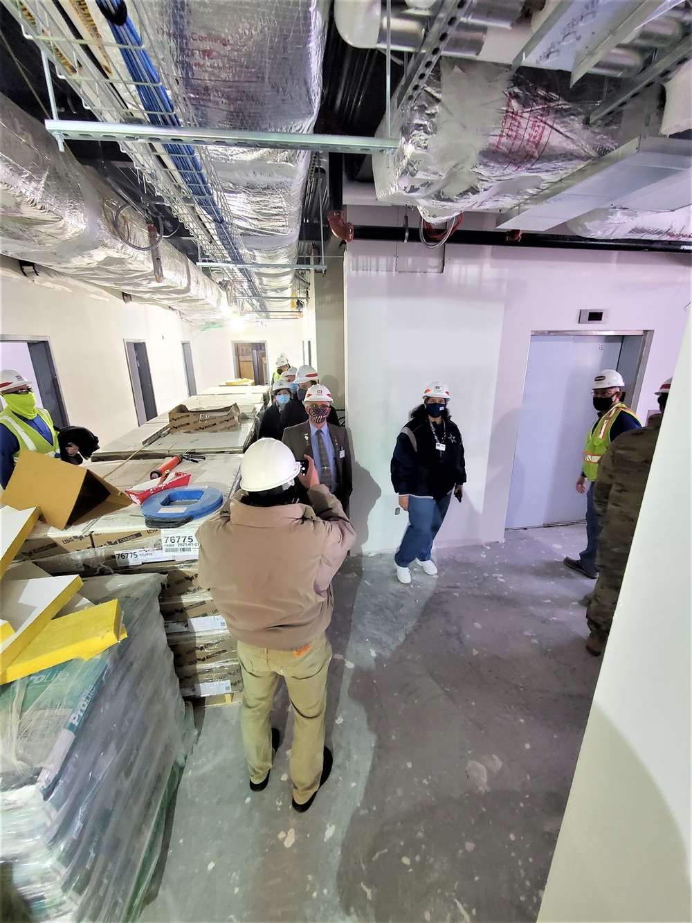 Visitors view construction of new, modern barracks building continues at Fort McCoy