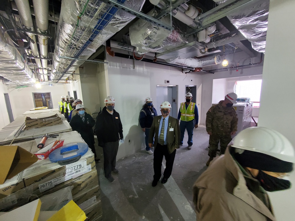 Visitors view construction of new, modern barracks building continues at Fort McCoy