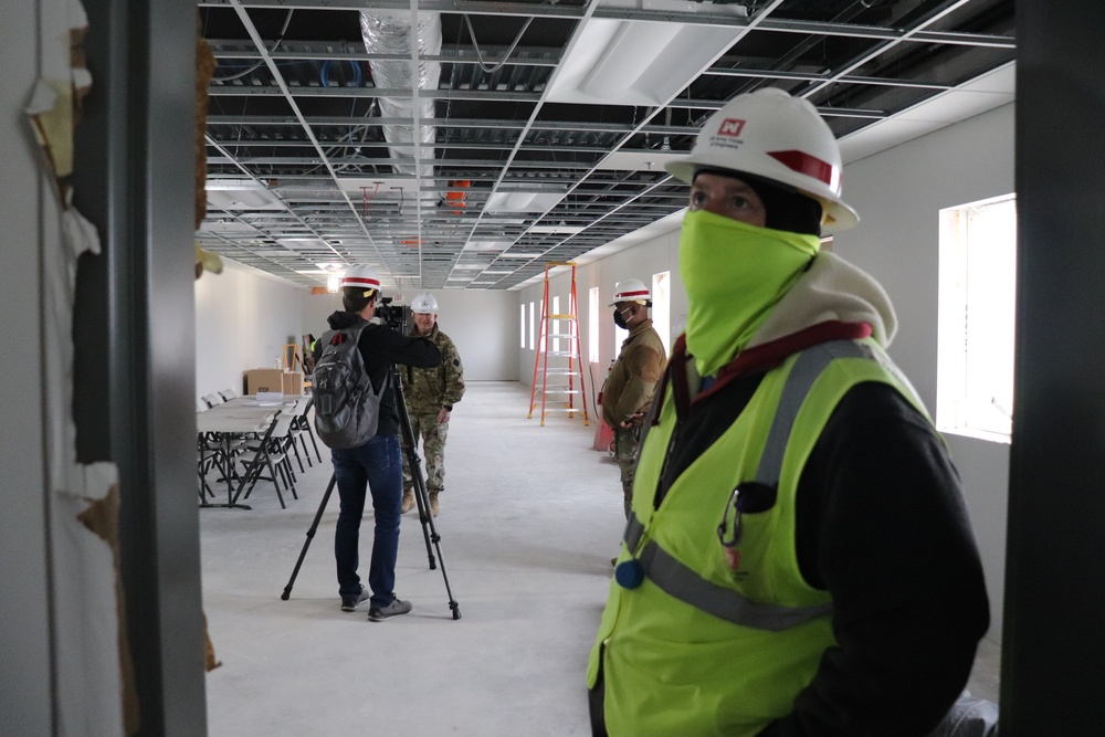 Visitors view construction of new, modern barracks building continues at Fort McCoy