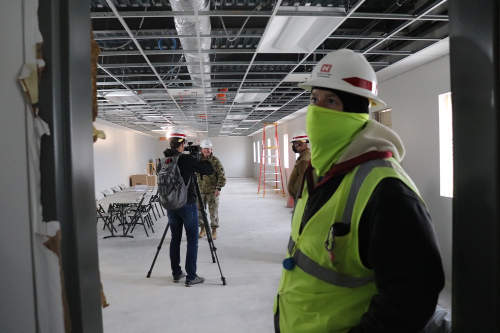 Visitors view construction of new, modern barracks building continues at Fort McCoy