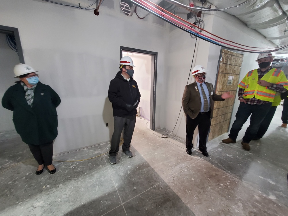 Visitors view construction of new, modern barracks building continues at Fort McCoy