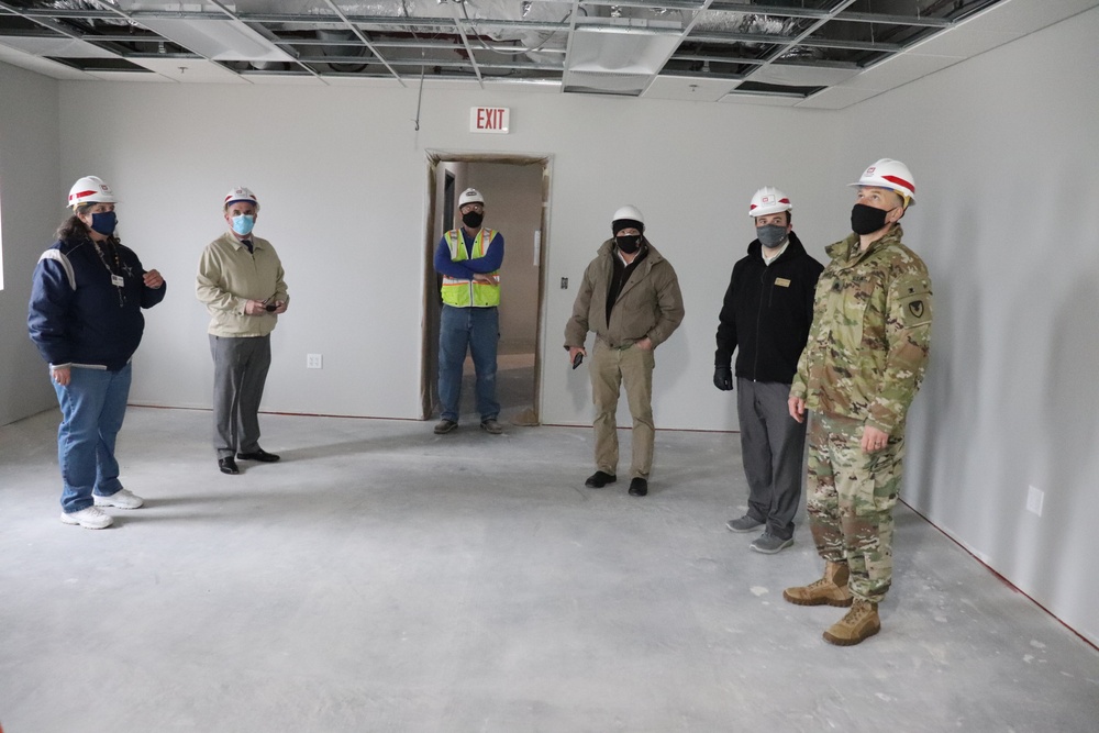 Visitors view construction of new, modern barracks building continues at Fort McCoy