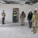 Visitors view construction of new, modern barracks building continues at Fort McCoy