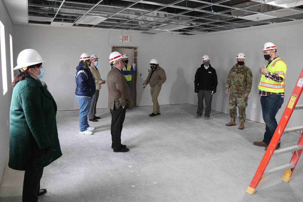 Visitors view construction of new, modern barracks building continues at Fort McCoy