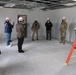 Visitors view construction of new, modern barracks building continues at Fort McCoy