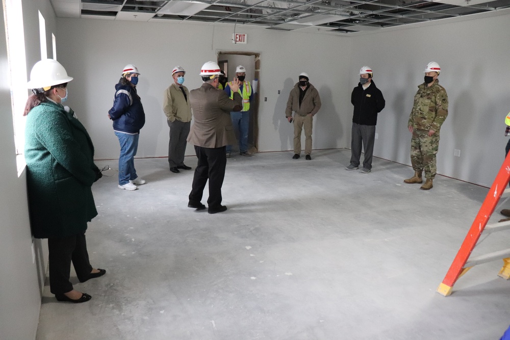 Visitors view construction of new, modern barracks building continues at Fort McCoy