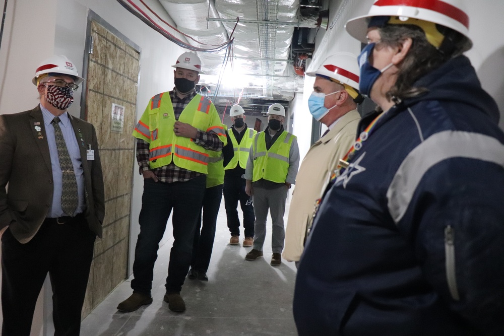 Visitors view construction of new, modern barracks building continues at Fort McCoy