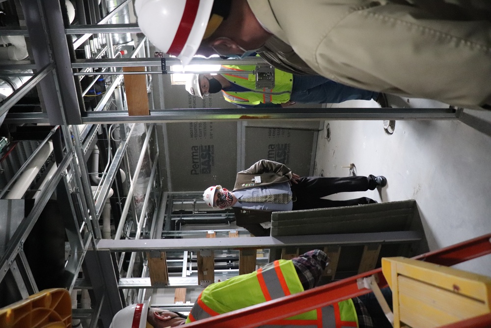 Visitors view construction of new, modern barracks building continues at Fort McCoy