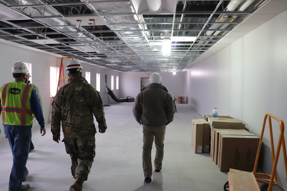 Visitors view construction of new, modern barracks building continues at Fort McCoy